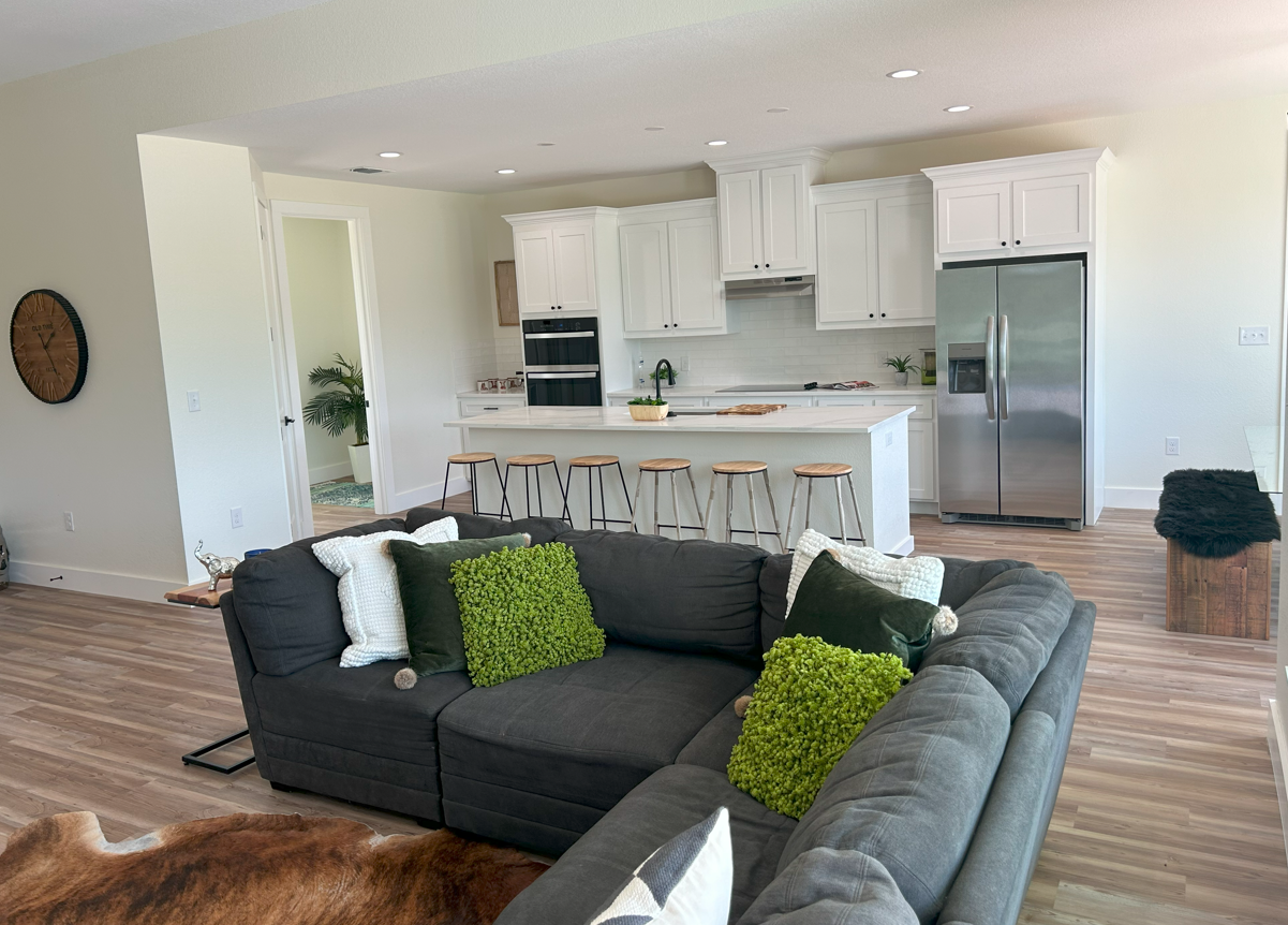 Staged living room and kitchen from the 150 Brooks Lane project